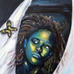 painting of a woman's face peeking through and a butterfly