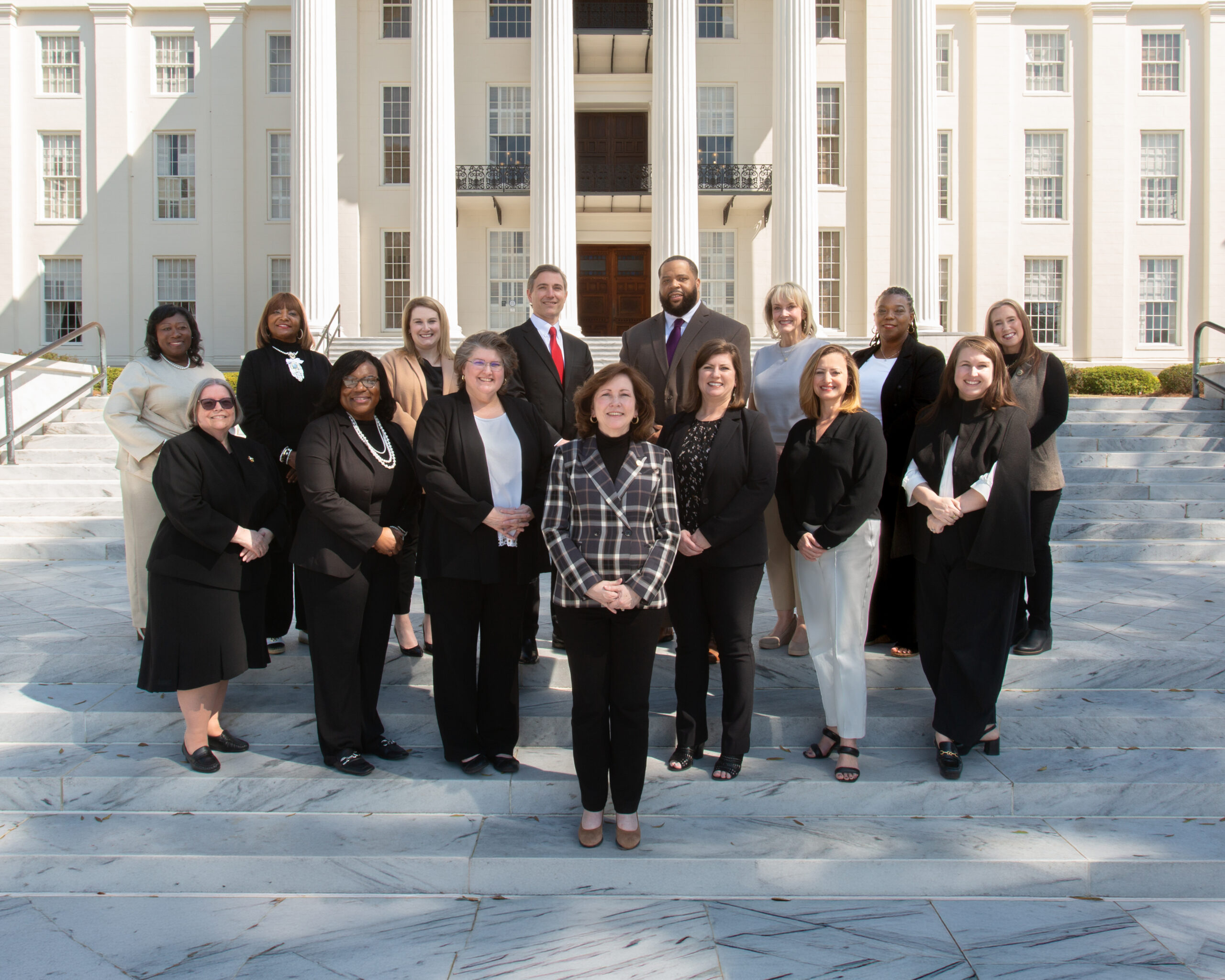 ADMH Leadership team standing on the state of the state Capitol photo of the ADMH Leadership team standing on the state of the state Capitol