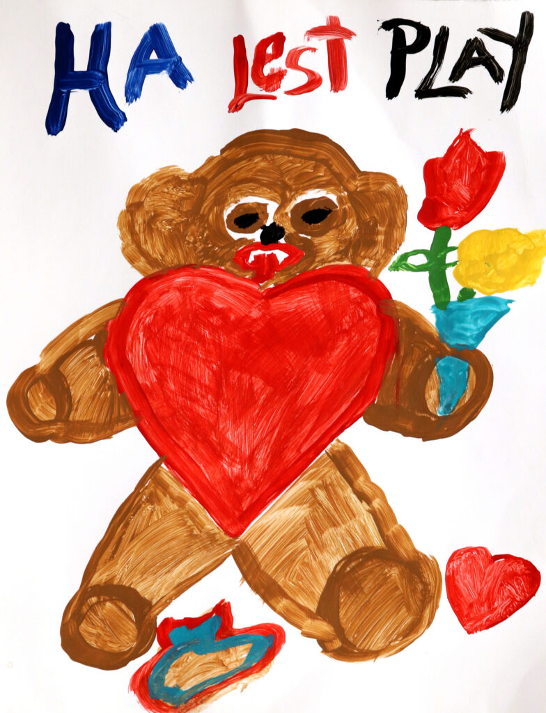 a teddy bear with a heart holding flowers