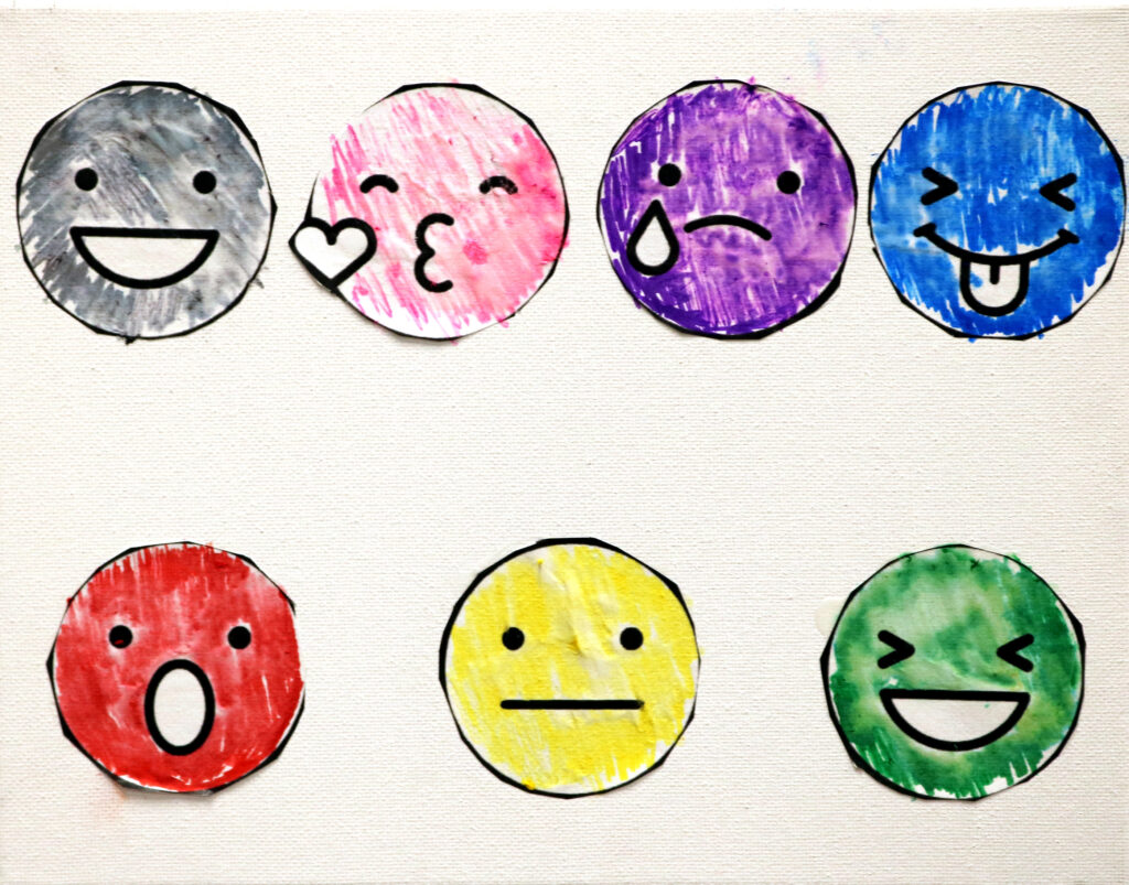 several smiley faces with varied expressions