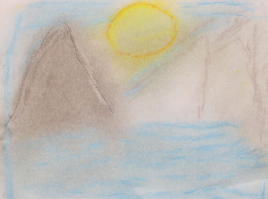 a sun rising over some mountains in a fog