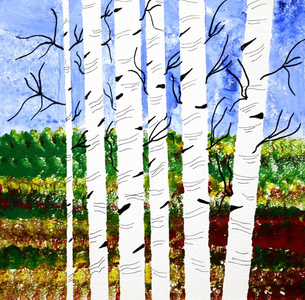 several white trees against a colorful landscape