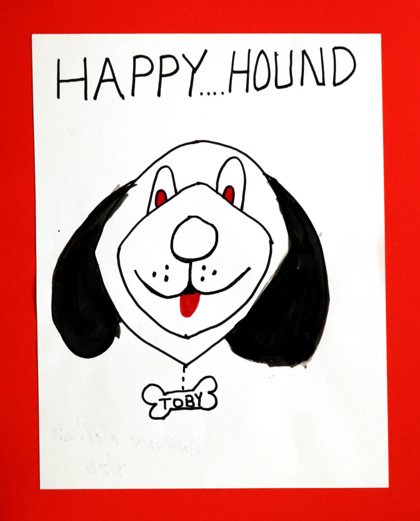 face of a dog with the words Happy Hound