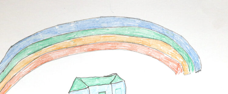a house beneath a large rainbow
