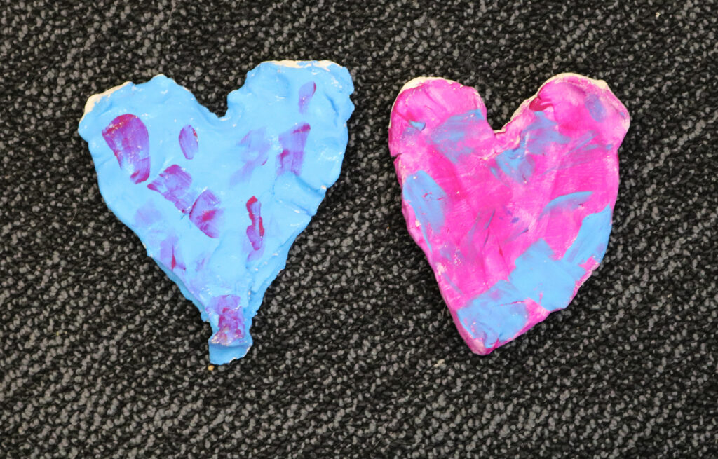 sculptures of hearts in pink and blue