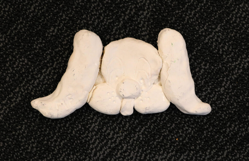 a sculpture of a dog face