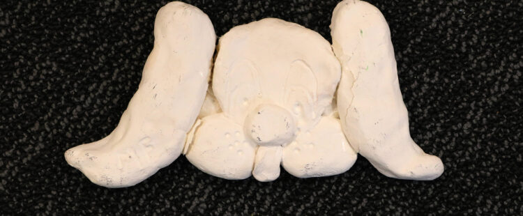 a sculpture of a dog face