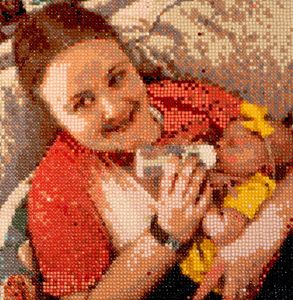 a woman bottle feeding a baby