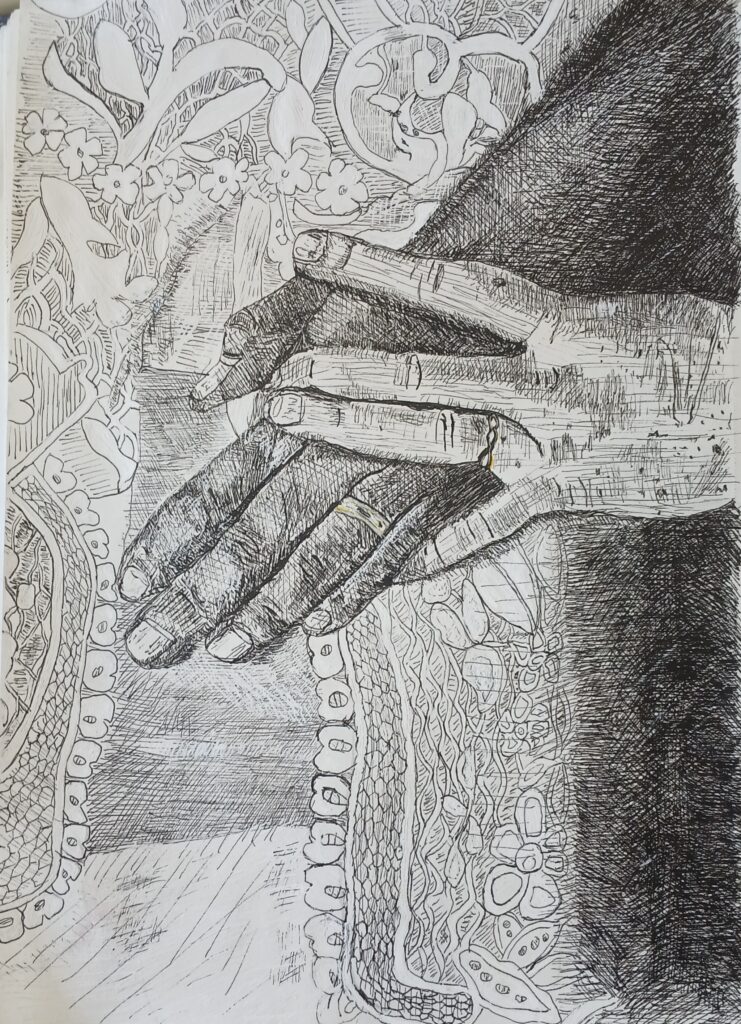two hands over some fabric